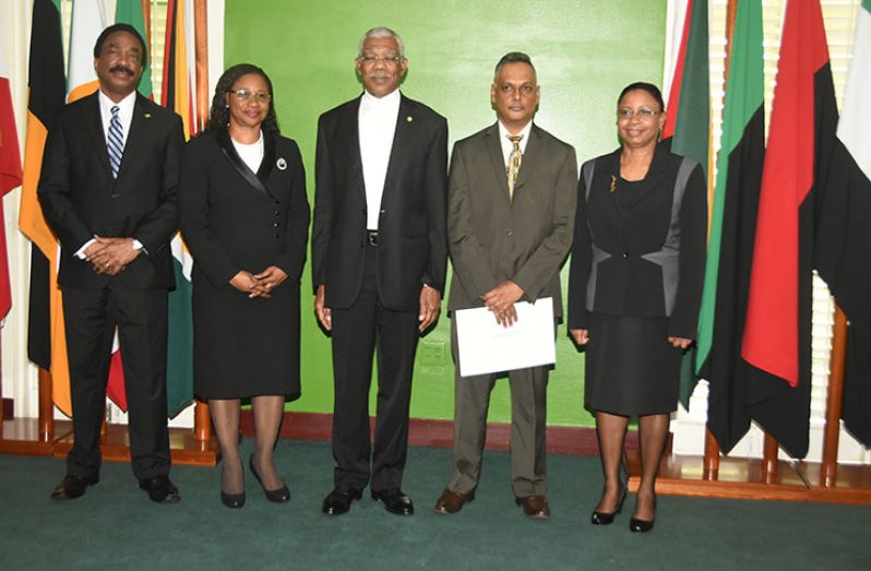 Newly-appointed acting Justice of Appeal, Dr Arif Bulkan (second right) stands alongside President David Granger (centre), Justices Yonette Cummings- Edwards (second left) and Roxanne George-Wiltshire, S.C. (right) and Attorney General and Minister of Legal Affairs, Basil Williams S.C. (Adrian Narine)