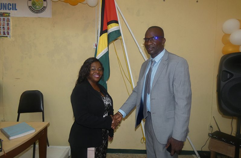 Re-elected Mayor of Linden Her Worship Waneka Arindell and her Deputy Wainwright Bethune sharing a handshake of congratulations