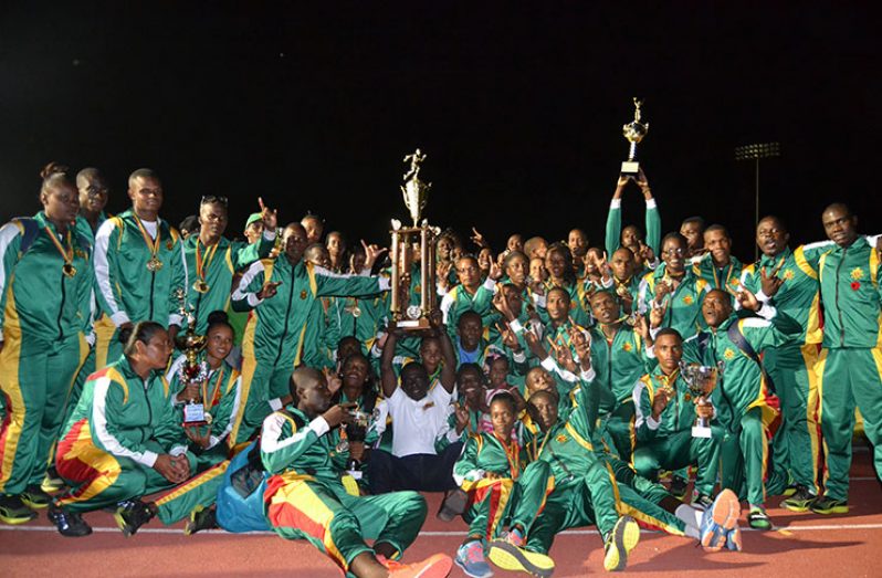 The GDF team show off their hardware as they celebrate their Joint Services win last Friday night.