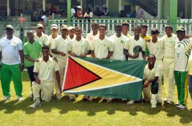 West Indies middle order batsman Shivnarine Chanderpaul (extreme left) and Guyana Cricket Board president Drubahadur (right) join the national Under-19 team and their coach, who proudly display the Golden Arrowhead, following their innings victory over Trinidad and Tobago yesterday.
