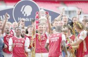 Arsenal's Pierre-Emerick Aubameyang with teammates celebrate with the trophy after winning the FA Cup, yesterday, as play resumed behind closed doors following the outbreak of the coronavirus disease (COVID-19). (Pool via REUTERS/Adam Davy)