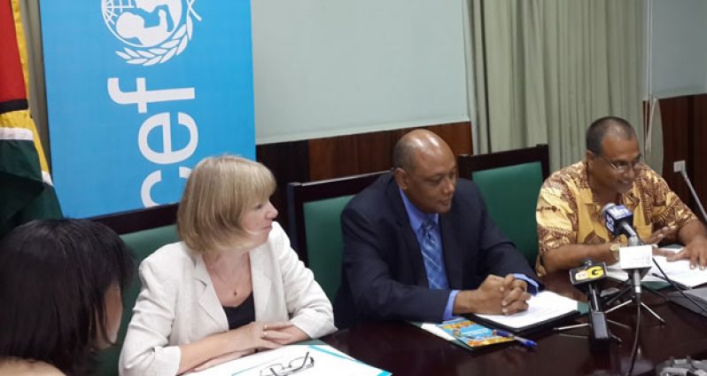 From left, Marianne Flach, UNICEF Representative, Guyana and Suriname; Speaker of the National Assembly, Mr. Raphael Trotman and Mr. Philbert Gajadhar of the University of Guyana.