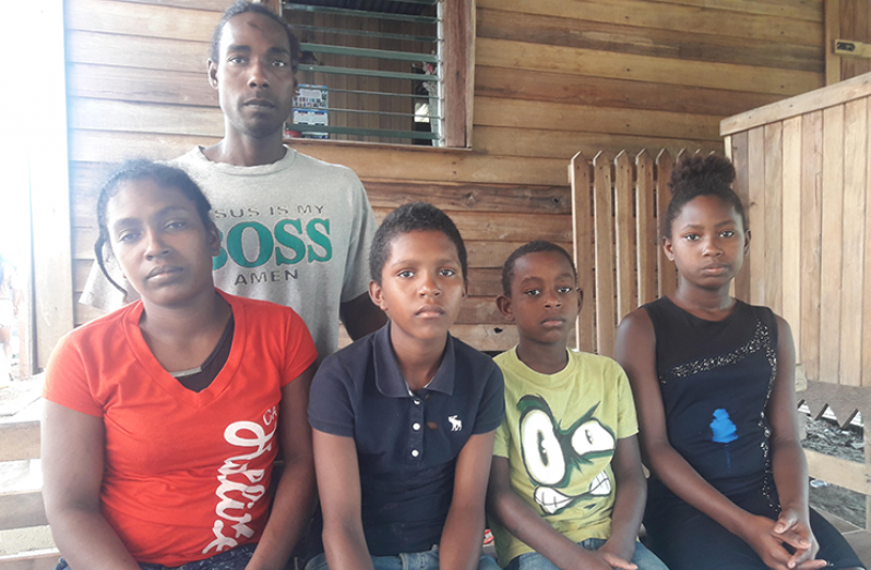 Family in mourning: From left Samantha Downer (mother); siblings, Romaldo, Orlando, and Celina with father Sylvester Durant standing
