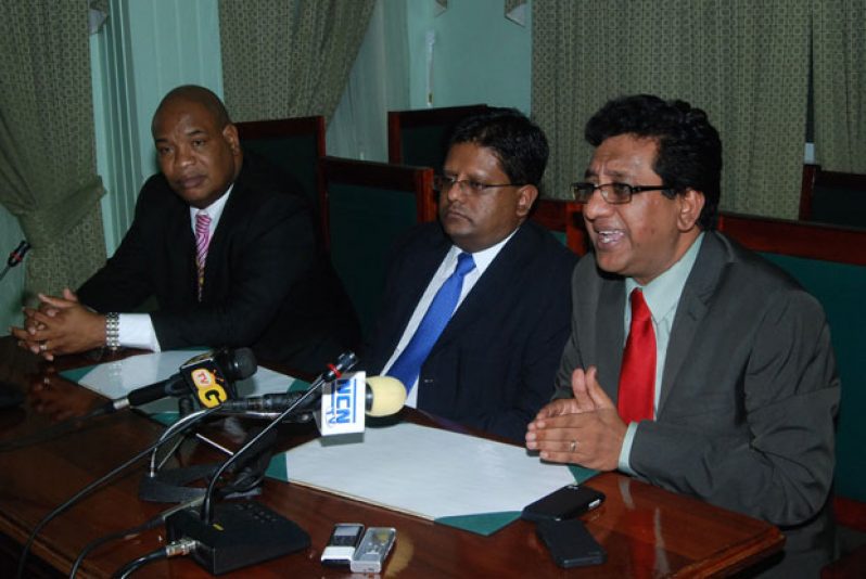 ‘FRUSTRATED’: Finance Minister Dr Ashni Singh is flanked by Minister within the Ministry of Finance Juan Edghill and Attorney General Anil Nandlall during a press conference late last night. (Cullen Bess-Nelson photo)
