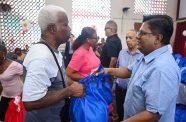 Senior Minister in the Office of the President with Responsibility for Finance, and the Public Service, Ashni Singh distributing Christmas Hampers at the Salvation Army’s distribution