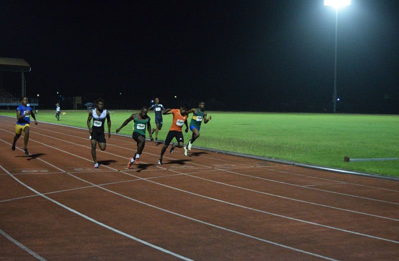 Akeem Stewart sprints through the line to win the men’s 100m.