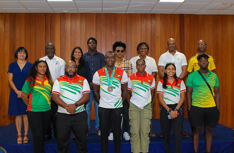 The present athletes and officials at yesterday's simple ceremony (Shaniece Bamfield Photos)