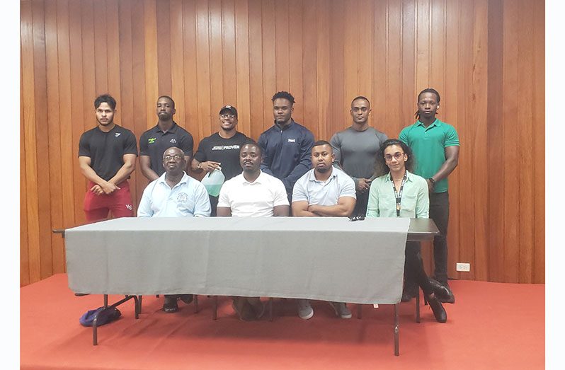 Officials from the Guyana Bodybuilding and Fitness Federation along with athletes at the Guyana Olympic Association headquarters on Wednesday