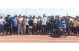 Minister of Culture, Youth and Sports Charles Ramson (middle) with Athletes, AAG and NSC Officials at the Leonora Track and Field Stadium yesterday (Photo by Yohan Savory)