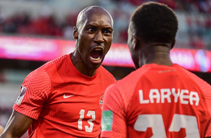 First goal scorer of the night for Canada Atiba Hutchinson (left) celebrates with his teammate Richie Laryea in the Concacaf Qualifiers for Qatar 2022 on September 8, 2021, at BMO Field in Toronto, Canada.