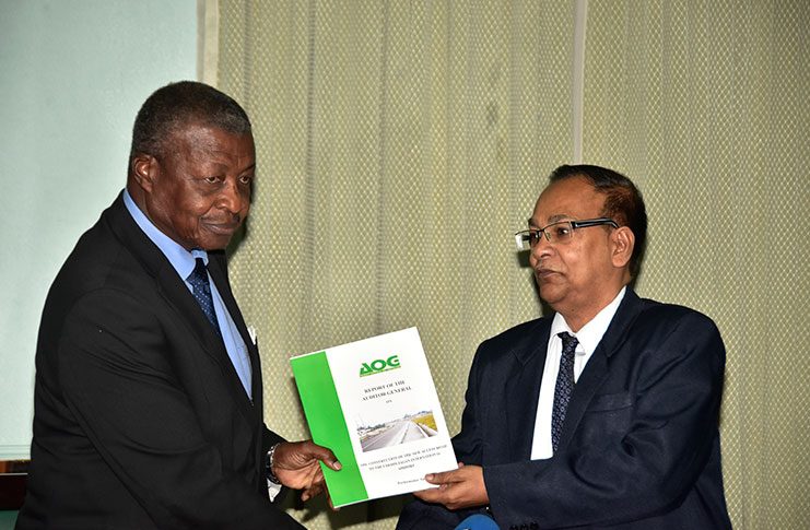 House Speaker Dr. Barton Scotland receives the 2016 Auditor General’s Report and the report pertaining to construction of the new access road to the Cheddi Jagan International Airport