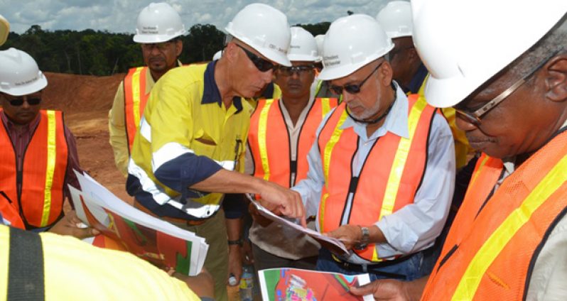 President Donald Ramotar and Minister of Public Works, Mr Robeson Benn being briefed on the progress of work by Guyana Gold Fields Inc CEO, Mr.  Scot Caldwell  at one of the sites at Aurora