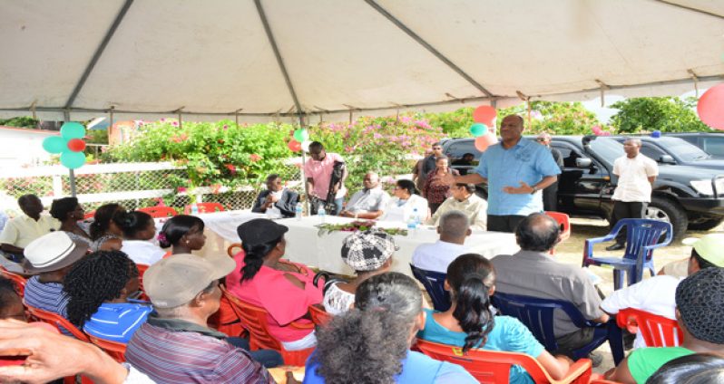 Minister of State, Joseph Harmon, addressing the residents of Aurora on Thursday afternoon after delivering the cheque for $217,500 for infrastructure development (Samuel Maughn photo)