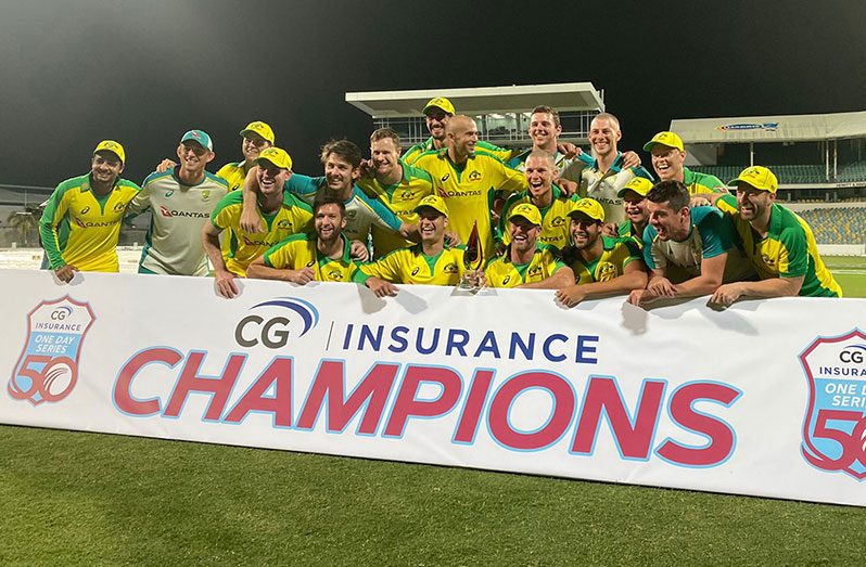 The Australians celebrate their ODI series victory over the West Indies  at Kensington Oval last night.