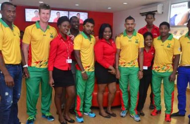 Calling all Warriors! From left, Christopher Barnwell, James Neesham, Veerasammy Permaul, Sunil Narine, Krishmar Santokie and Navin Stewart, strike a pose with Digicel’s Sponsorship and Events Manager Gavin Hope (partly hidden 4th from left) and staff of Digicel’s Avenue of the Republic outlet. (Photo by Adrian Narine)