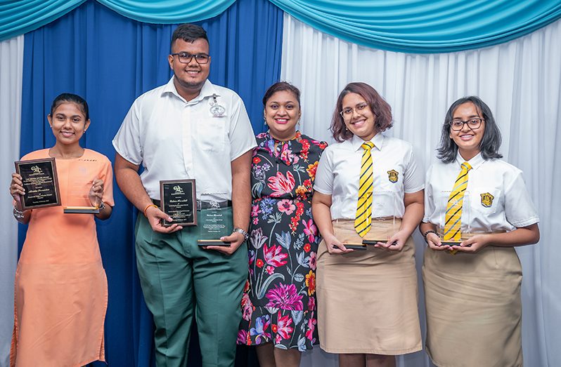 Atishta Seenarine, Outam Heeralall, Saskia Twahir, and Sheridan Dyal with Education Minister Priya Manickchand (centre)