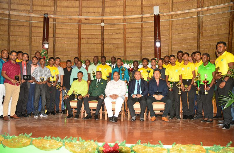 Seated from left are - Dr Shivnarine Chanderpaul, Anand Sanasie, Prime Minister and First Vice-President Moses Nagamootoo, Minister of Social Cohesion, with responsibility for Culture, Youth and Sport Dr George Norton and Howard Cox with the awardees. (Adrian Narine photos)