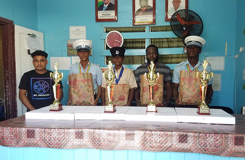 RHTY&SC Assistant Secretary/CEO, Simon Naidu, poses with the four awardees