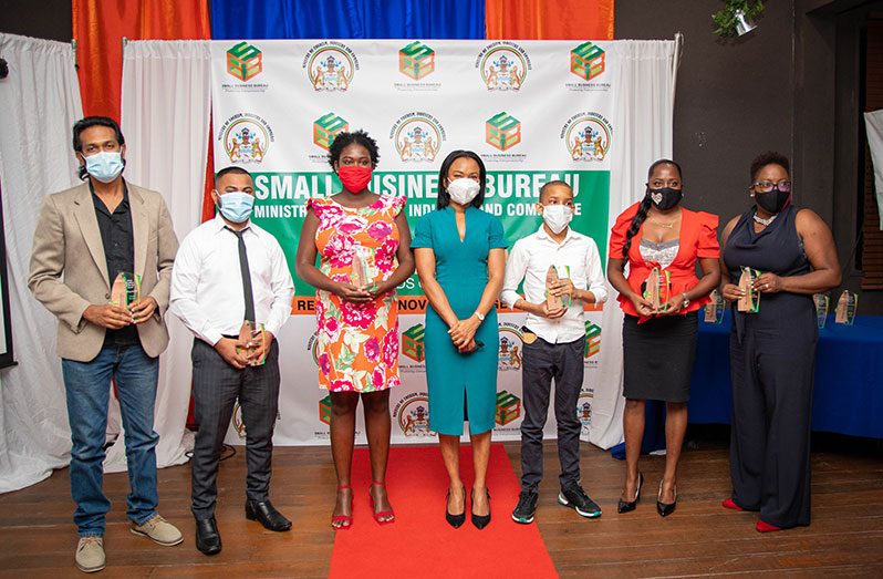 Minister of Tourism, Industry and Commerce, Oneidge Walrond with some of the awardees