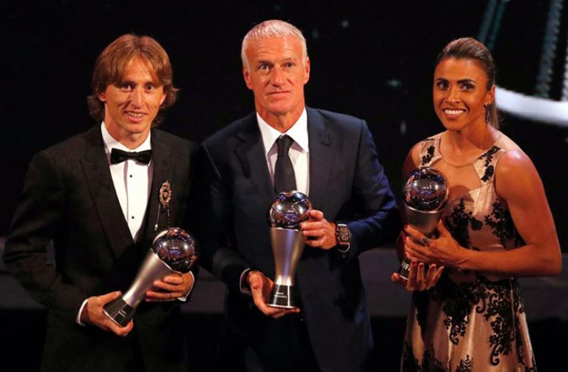 Luka Modric, Didier Deschamps and Marta pose with their awards Action Images via Reuters/John Sibley
