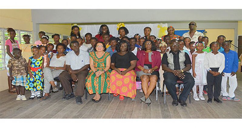 First Lady, Mrs Sandra Granger, and facilitators, pose with the graduates from the ICT Training Programme