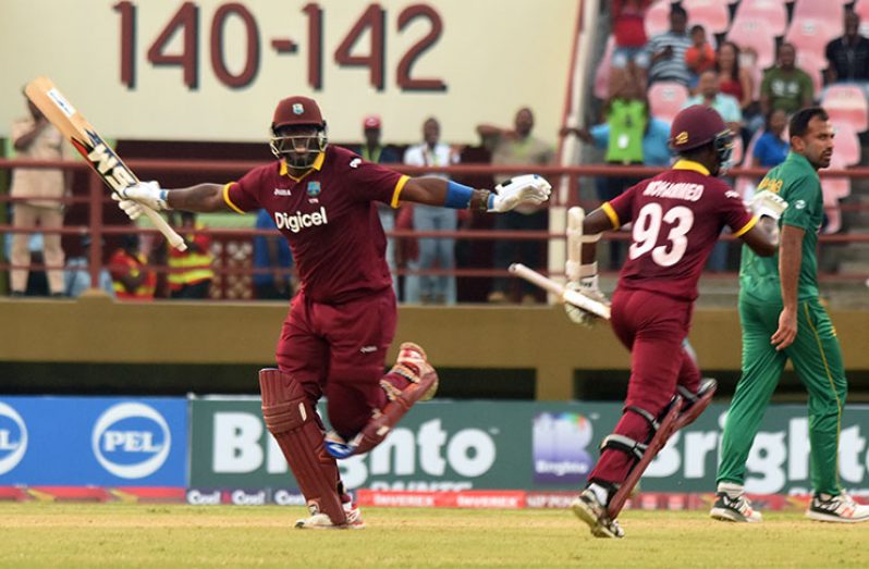 HISTORIC CELEBRATION! Ashley Nurse
(L) and Jason Mohammed celebrates after
helping West Indies to a historic win against