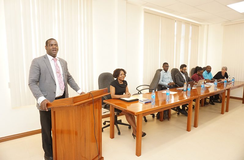 Director of the Department of Multilateral and Global Affairs, Troy Torrington speaks to the gathering at the Ministry of Foreign Affairs, Ramphal House as several experts on the Ministry’s team watch on (Carl Croker photo)