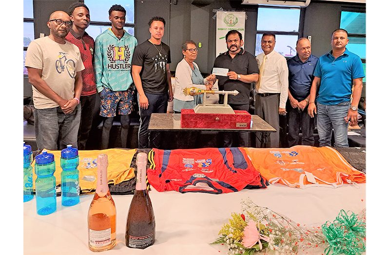 BCB's Angella Haniff (left) is presenting the cheque from Dave Narine as officials from the BCB, GCA and national players from Berbice share the moment (Sean Devers photo)