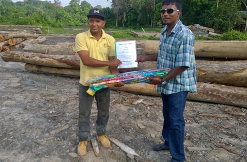 Mr. Elymuwell Barkoye, Regional Democratic Councillor, Sub-Region 10, 
receiving kites and Information Booklets from