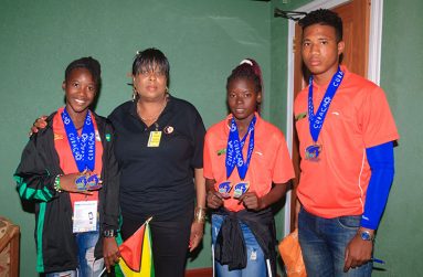 Waveney Benn (second from left) with Chantoba Bright, Claudrice McKoy and Compton Caesar, upon their return to Guyana