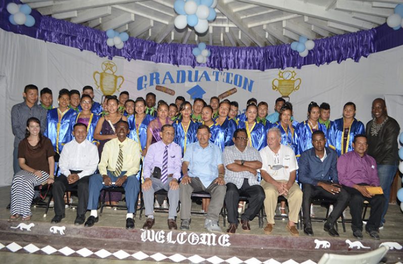 Minister of Indigenous People’s Affairs, Sydney Allicock, (centre); Region Eight Regional Chairman, Bonaventure Fredricks; Principal of the Bina Hill Institute, Victor Ferreira; board member of Bina Hill Institute, Colin Edwards,staff of the Bina Hill Institute and the graduates