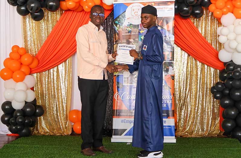 BIT Chief Executive Officer, Mr. Richard Maughn, issues a certificate to a participant who completed the rigorous training programmes