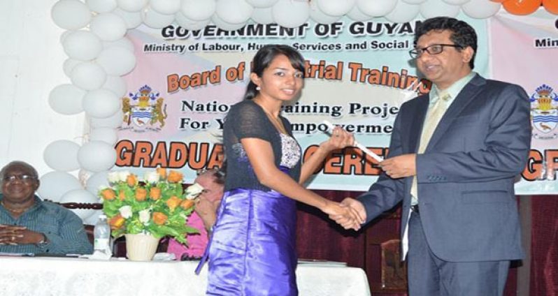 Attorney-General (AG) and Minister of Legal Affairs, Anil Nandlall hands a certificate to one of the graduates