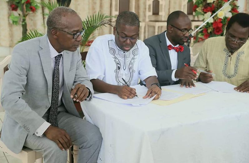 Labour Minister, Joseph Hamilon; BIT’s CEO, Richard Maughn and the SDA’s Pastor Jumoul Sancho and Pastor Dennis Hamilton, during the signing of the MoU and launching of the L.E.N.S.A. training programme (DPI photo)