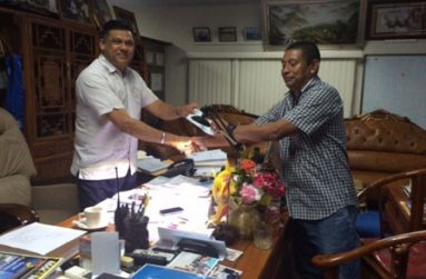 Brian Tiwari hands over cheque to GVF president John Flores