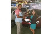 BM Soat Auto Sales representative, Nandanie Persaud, hands over the sponsorship cheque to Roy Jafarally of the Guyana Cup organising committee.