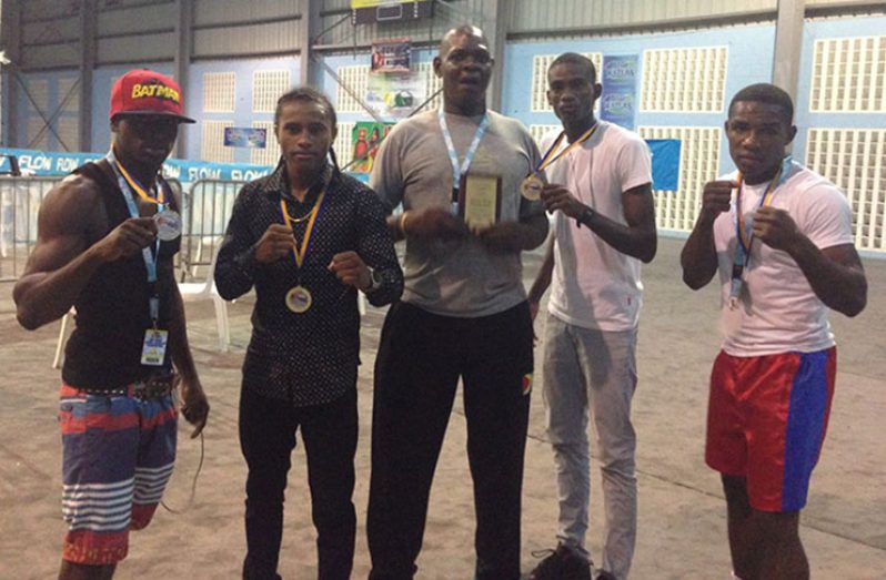 From left: Lightweight, Joel Williamson; bantamweight, Keevin Allicock; coach Terrence Poole; lightweight, Colin Lewis; and middleweight, Desmond Amsterdam