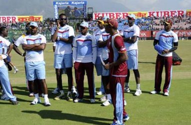 Dwayne Bravo captain of West Indies walks back with his team after the toss before the start of the 4th One Day International, ODI against India  on October 17.