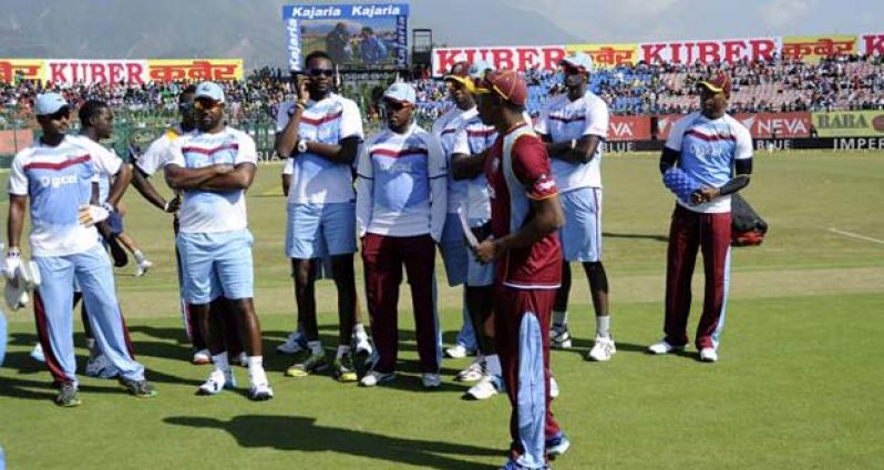 Dwayne Bravo captain of West Indies walks back with his team after the toss before the start of the 4th One Day International, ODI against India  on October 17.