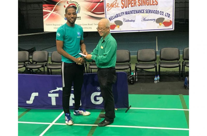 Shemar Britton receives his prize from Mr O. Young