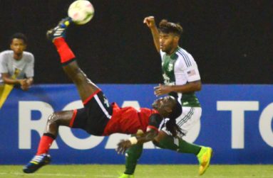 Alpha United Kithson Bain’s King Pele-made-famous bicycle kick finds its way to the goal but is saved by Portland Timbers goalkeeper Andrew Weber (Adrian Narine photo)