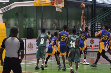 The Barbadian players paint a layup attempt.