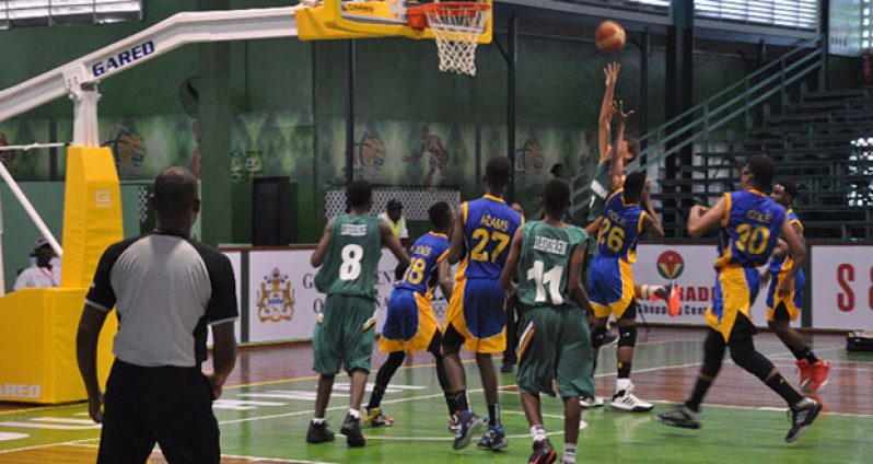 The Barbadian players paint a layup attempt.