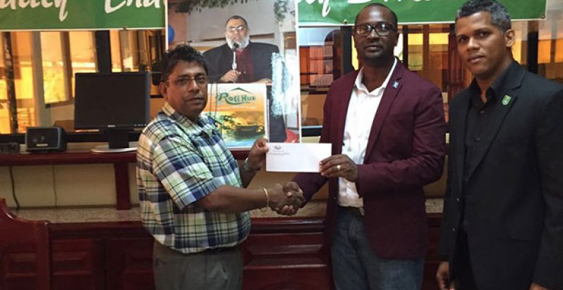 Rajin Ganga, General Manager (Bakewell) presents tickets to Mr. Wayne Forde, President of the GFF. Also in picture is GFF’s Marketing and Sponsorship Director, Dario Mc Klmon.