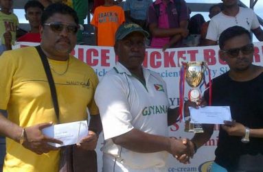 Shabeer Baksh, assistant treasurer of BCB, hands over the winning trophy and cash prize to the victorious captain, Jaipaul Heeralall of D’Edward Sports Club, in the presence of Anil Beharry, BCB’s first vice-president.