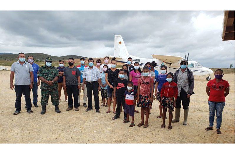 GWI's CEO, Shaik Baksh, along with the GDF representative and residents of Kato