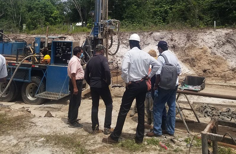 GWI's CEO, Shaik Baksh and team observe the well drilling at Five Miles