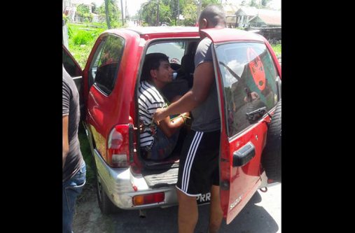 The bandit (in vehicle) who was apprehended following the robbery.