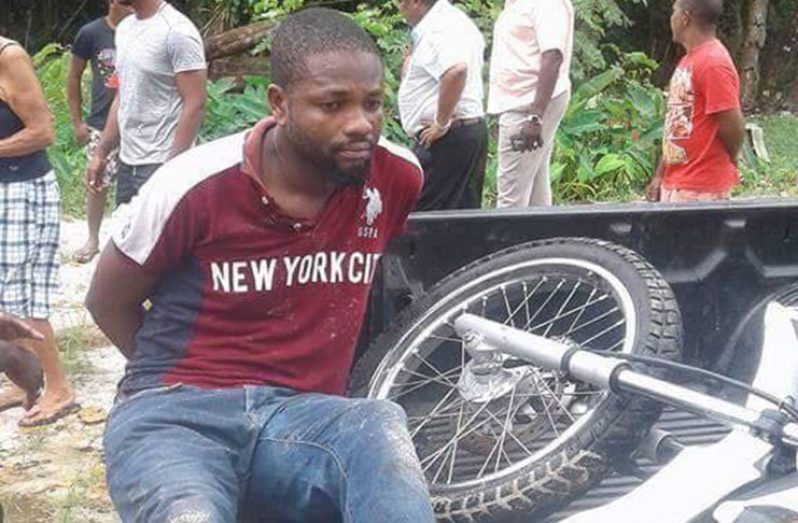 The alleged bandit, who was caught by police, with the CG motorcycle.