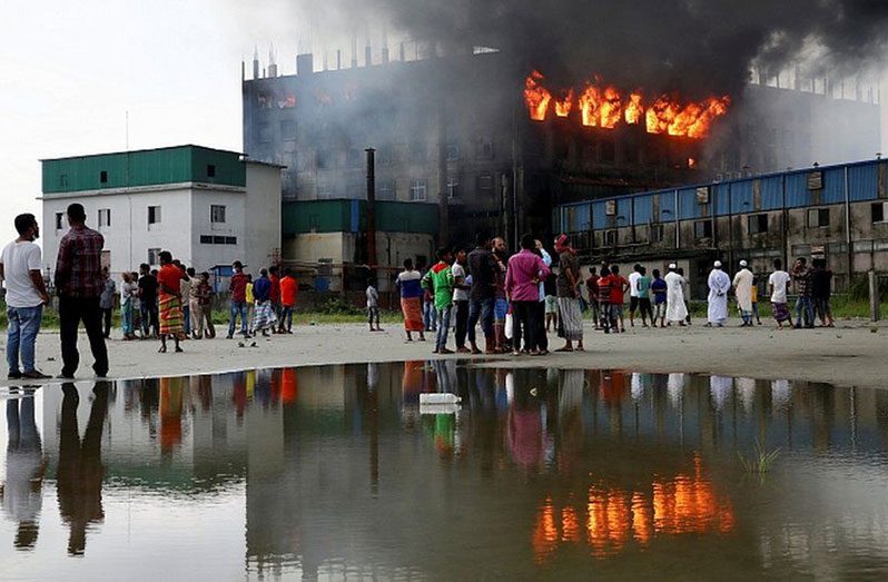 Victims were trapped inside the burning building because a key exit had been locked, officials said